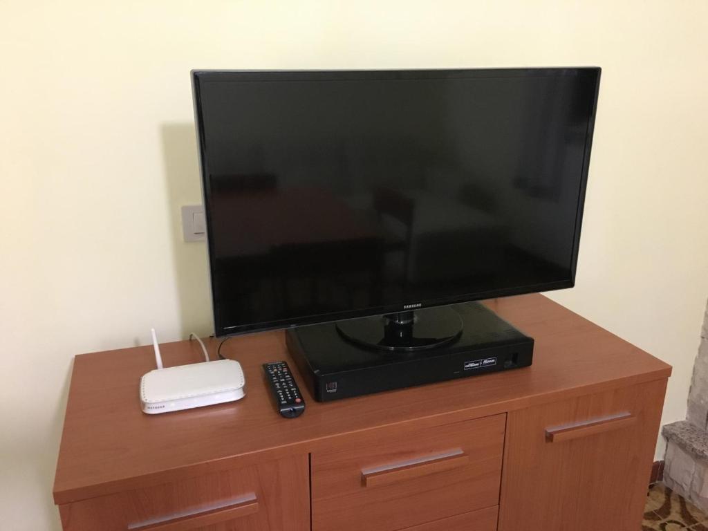 TV a/nebo společenská místnost v ubytování Grano Arso Appartamento Turistico
