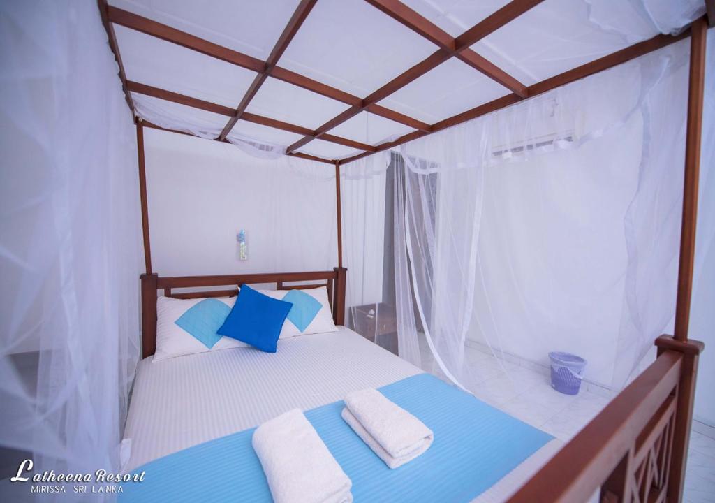 Postel nebo postele na pokoji v ubytování Latheena Resort