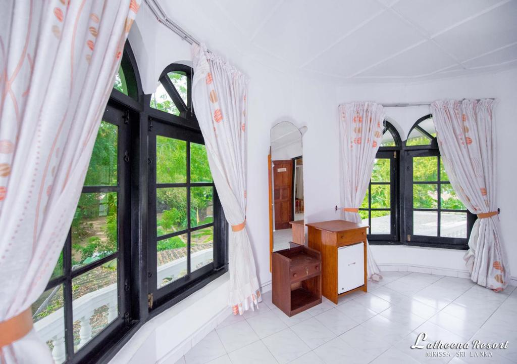 Postel nebo postele na pokoji v ubytování Latheena Resort