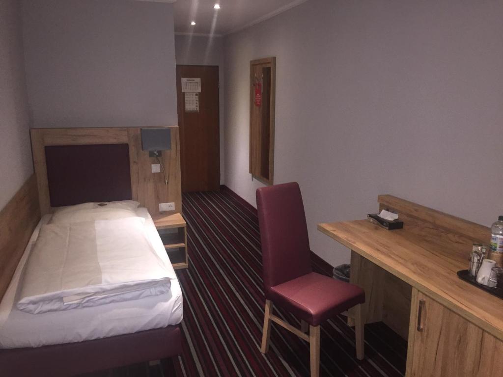 Postel nebo postele na pokoji v ubytování Hotel Süderelbe