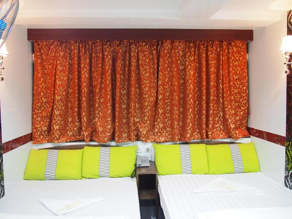 Katil atau katil-katil dalam bilik di Traveller's Hostel