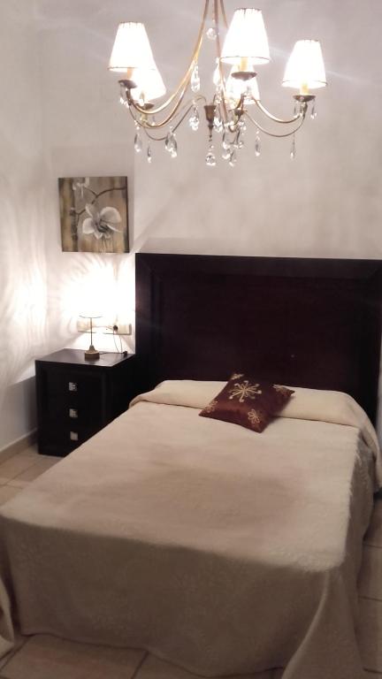 A bed or beds in a room at Villa Rosa Amparo