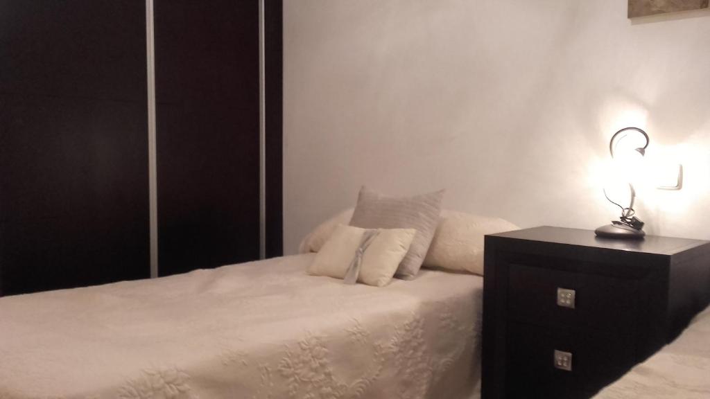 A bed or beds in a room at Villa Rosa Amparo