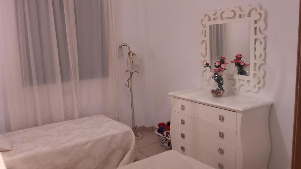 A bed or beds in a room at Villa Rosa Amparo