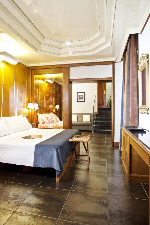 Postel nebo postele na pokoji v ubytování Hotel Valadier