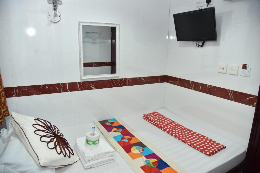 Katil atau katil-katil dalam bilik di Traveller's Hostel