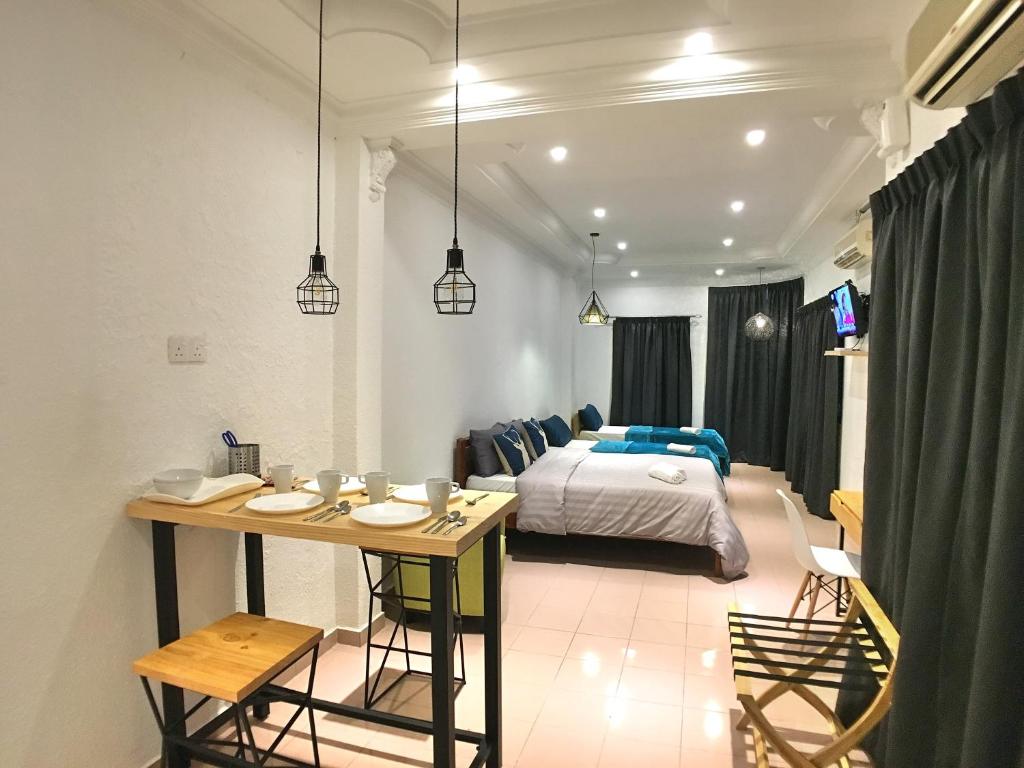 Postel nebo postele na pokoji v ubytování iBook Gurney Suites
