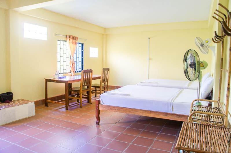 Postel nebo postele na pokoji v ubytování Visal Sak Guesthouse