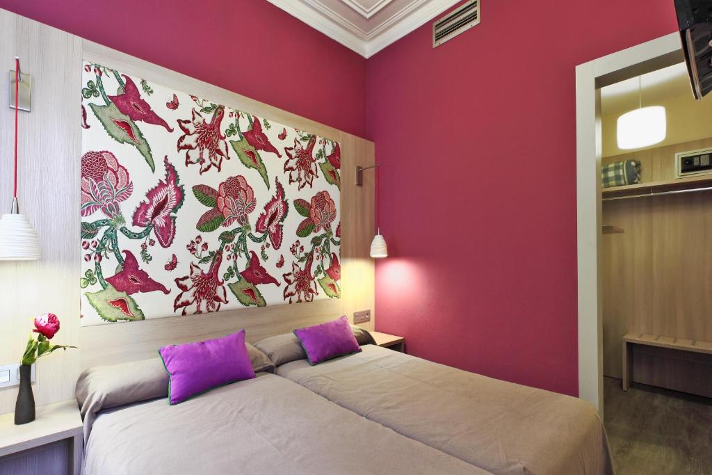 Posteľ alebo postele v izbe v ubytovaní Hotel Ginebra