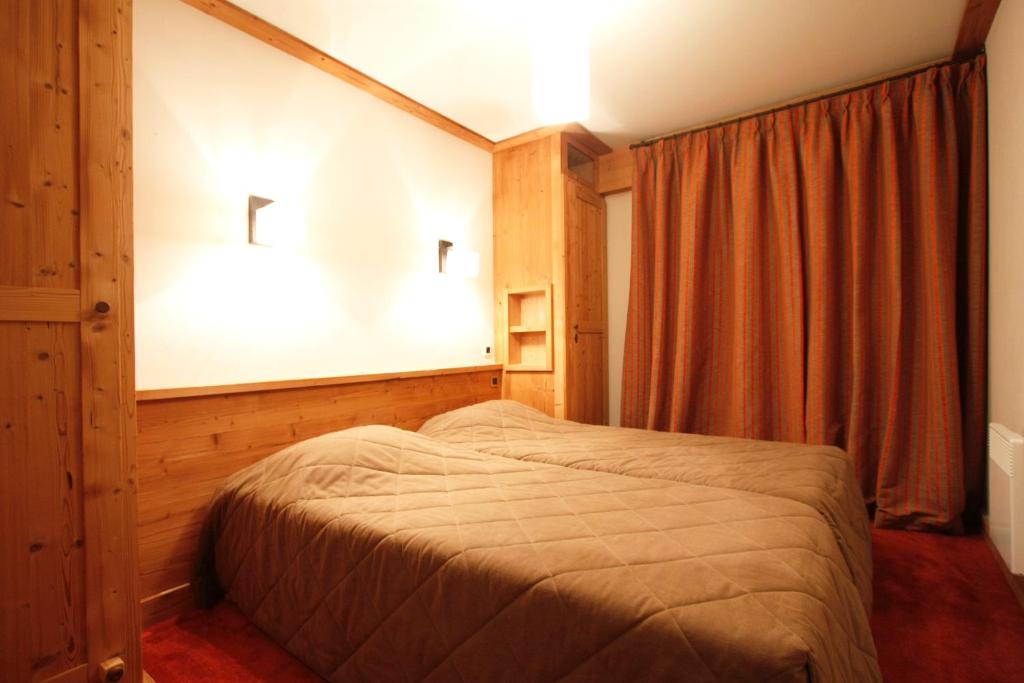 Postel nebo postele na pokoji v ubytování Vacanceole - Résidence Goléon -Val Ecrins