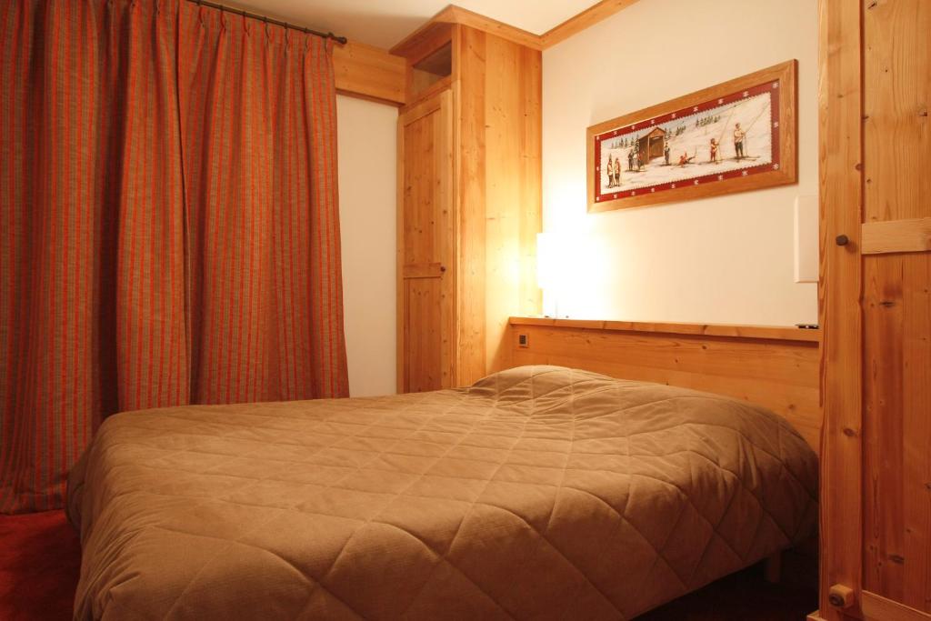 Postel nebo postele na pokoji v ubytování Vacanceole - Résidence Goléon -Val Ecrins