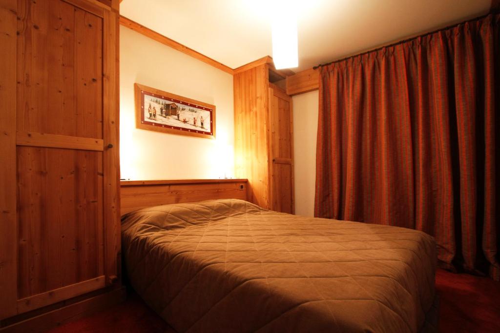 Postel nebo postele na pokoji v ubytování Vacanceole - Résidence Goléon -Val Ecrins
