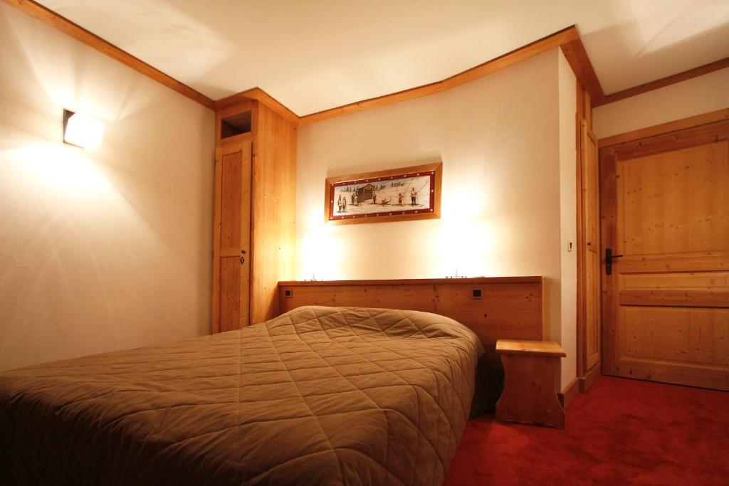Postel nebo postele na pokoji v ubytování Vacanceole - Résidence Goléon -Val Ecrins