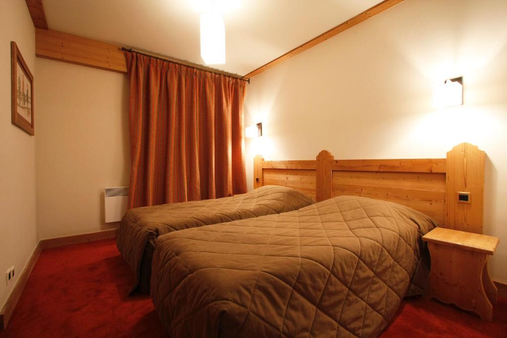 Postel nebo postele na pokoji v ubytování Vacanceole - Résidence Goléon -Val Ecrins