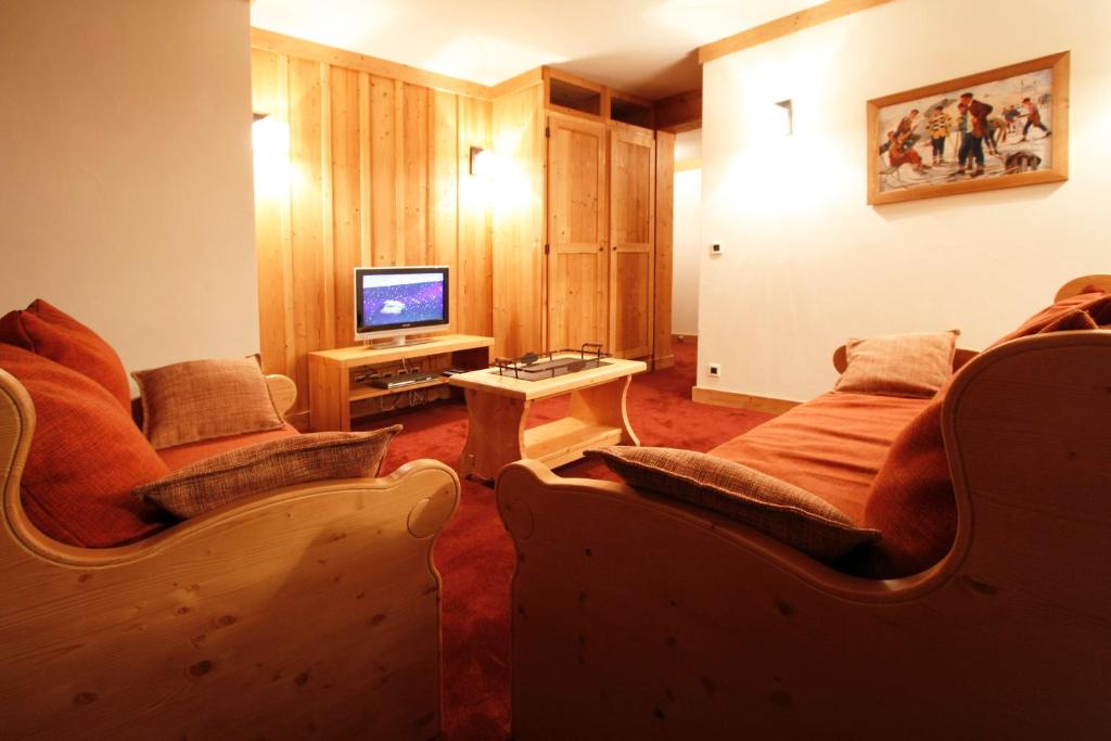 TV a/nebo společenská místnost v ubytování Vacanceole - Résidence Goléon -Val Ecrins