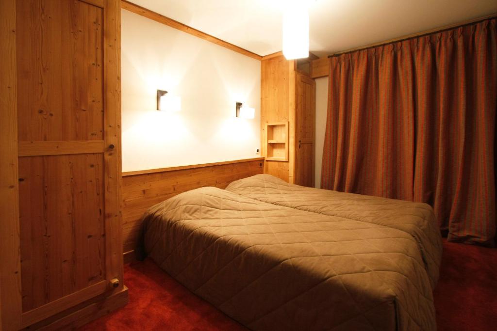 Postel nebo postele na pokoji v ubytování Vacanceole - Résidence Goléon -Val Ecrins