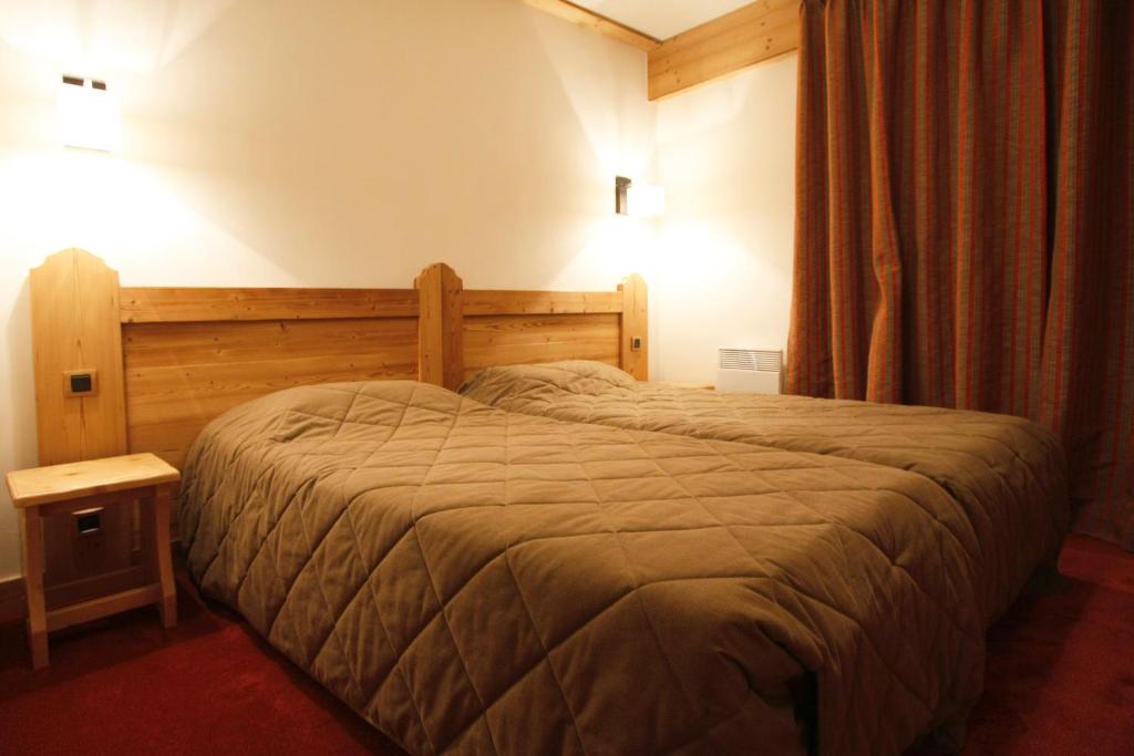 Postel nebo postele na pokoji v ubytování Vacanceole - Résidence Goléon -Val Ecrins
