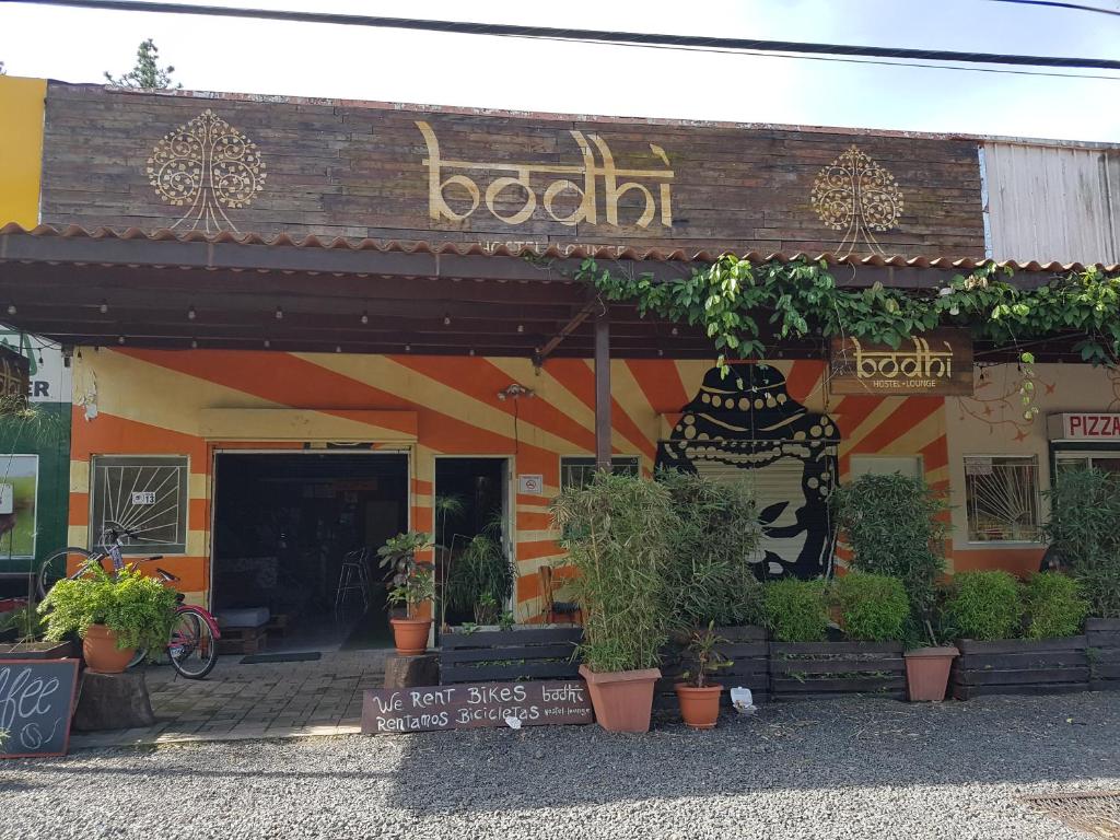 a store with plants in front of a building at Bodhi Hostel & Lounge in Valle de Anton