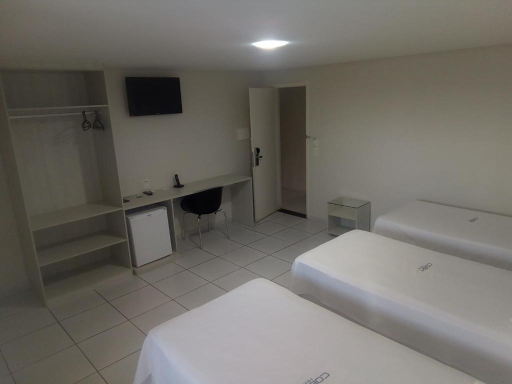Postel nebo postele na pokoji v ubytování COBH Hotel