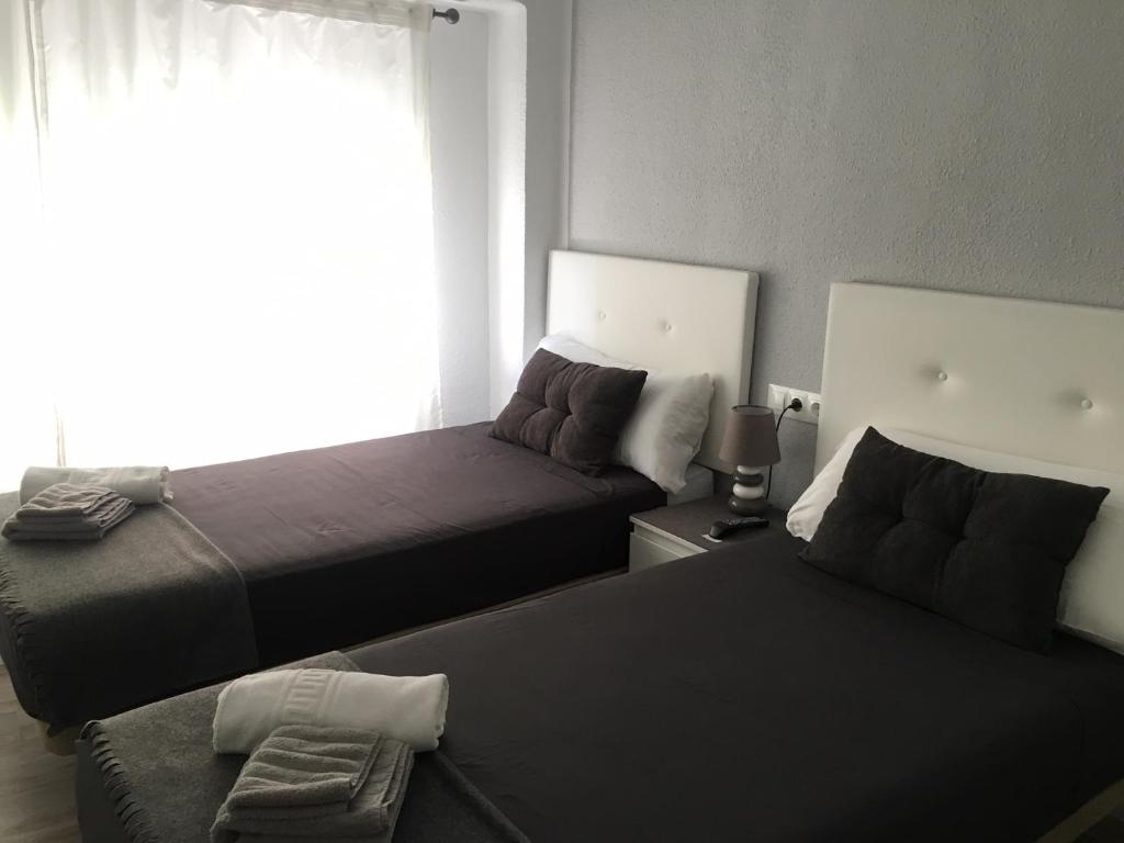 Postel nebo postele na pokoji v ubytování Guesthouse Central
