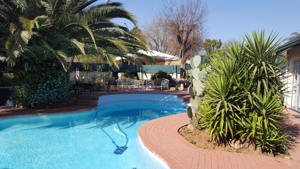 Πισίνα στο ή κοντά στο Sleep Eezy Cottages