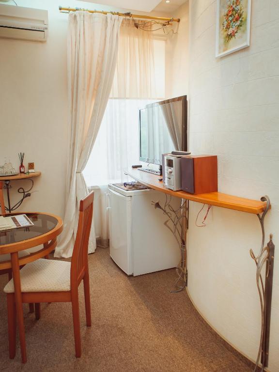 TV a/nebo společenská místnost v ubytování Hotel Diana