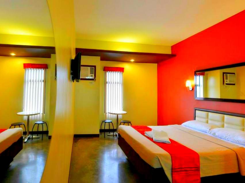 Postel nebo postele na pokoji v ubytování Express Inn Cebu Mabolo