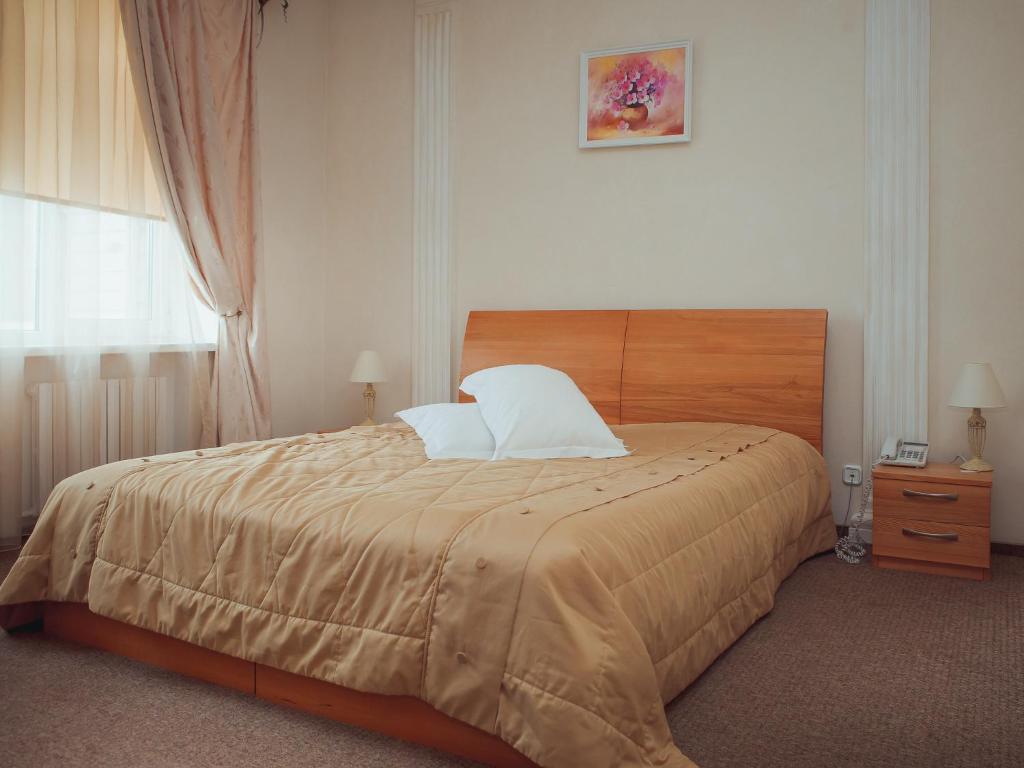 Postel nebo postele na pokoji v ubytování Hotel Diana