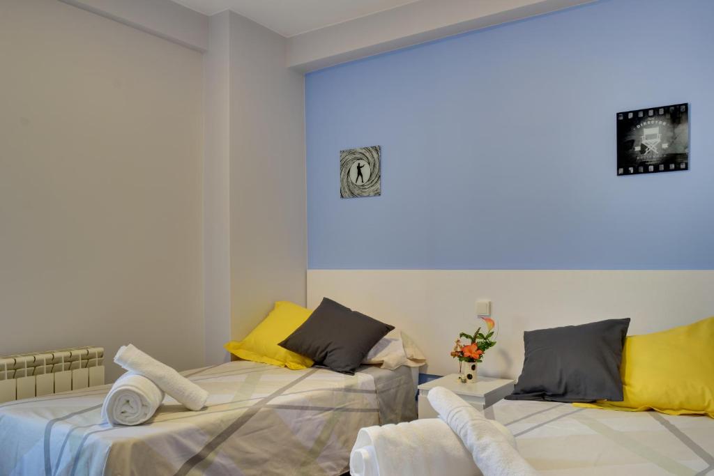Postel nebo postele na pokoji v ubytování Apartamentos San Lázaro