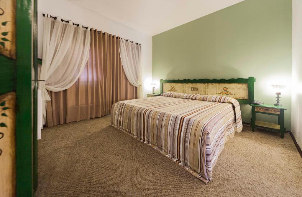 Postel nebo postele na pokoji v ubytování Hotel Tannenhof