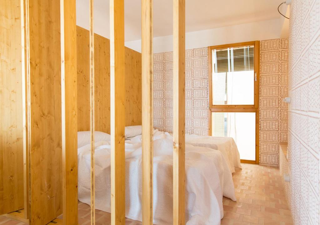Postel nebo postele na pokoji v ubytování Moll Petit Apartments - Turismo de Interior
