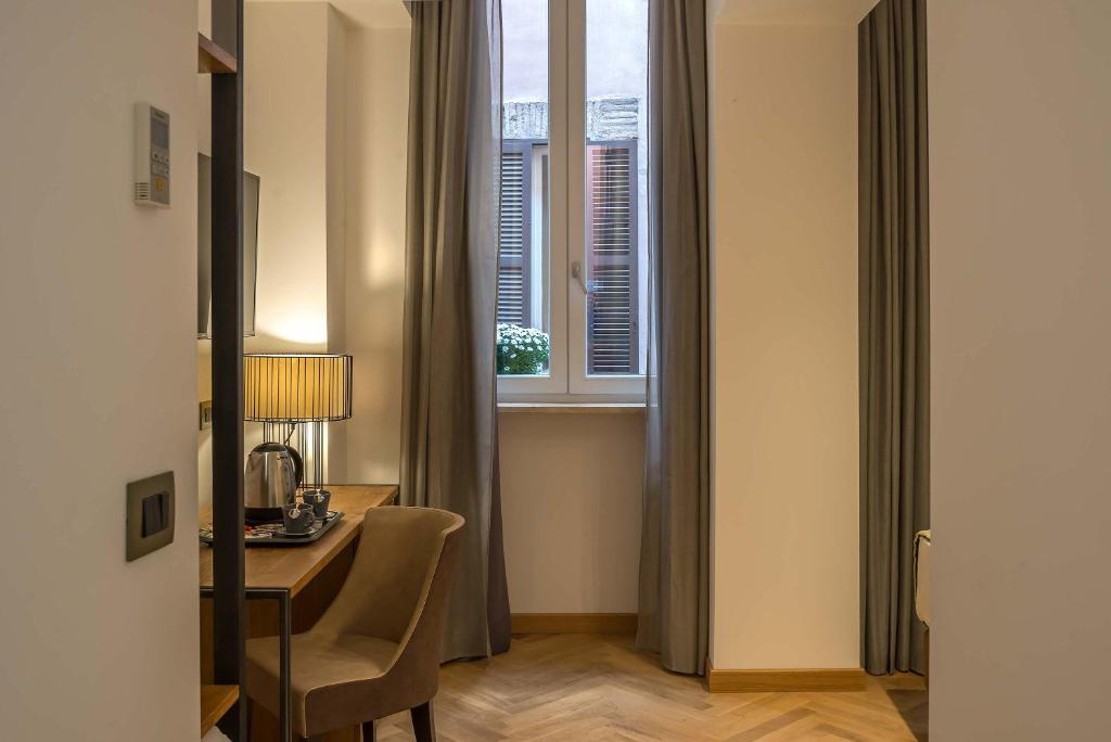 TV a/nebo společenská místnost v ubytování Navona Essence Hotel