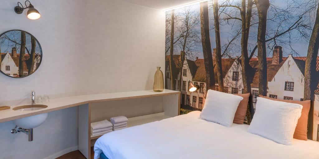 Postel nebo postele na pokoji v ubytování Hotel Marcel