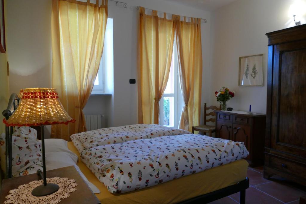 Postel nebo postele na pokoji v ubytování Il Grillo Parlante