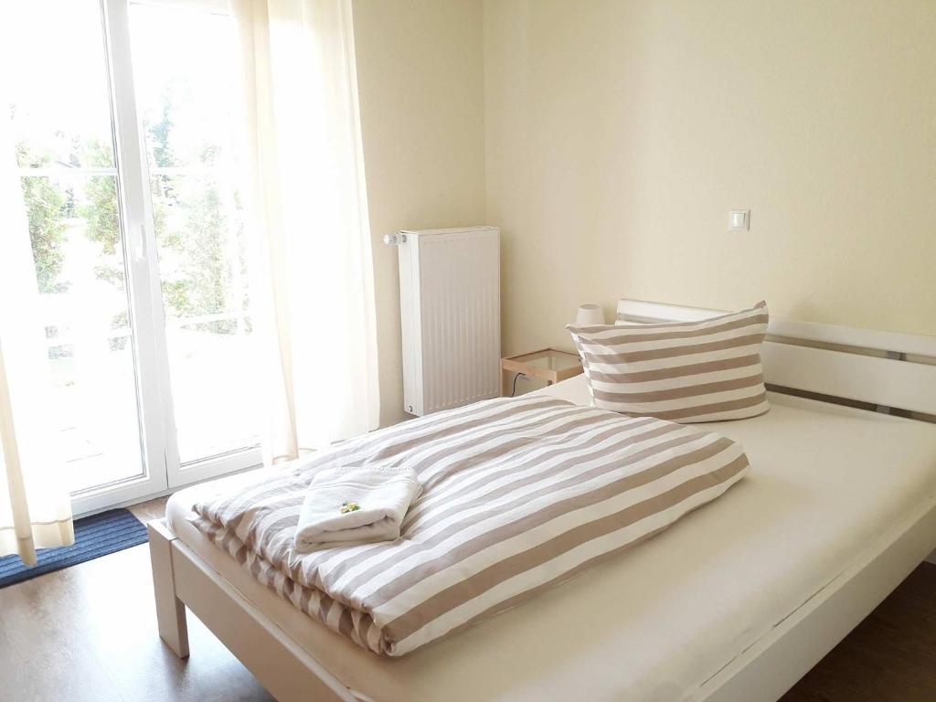 Postel nebo postele na pokoji v ubytování Gästehaus Beckord