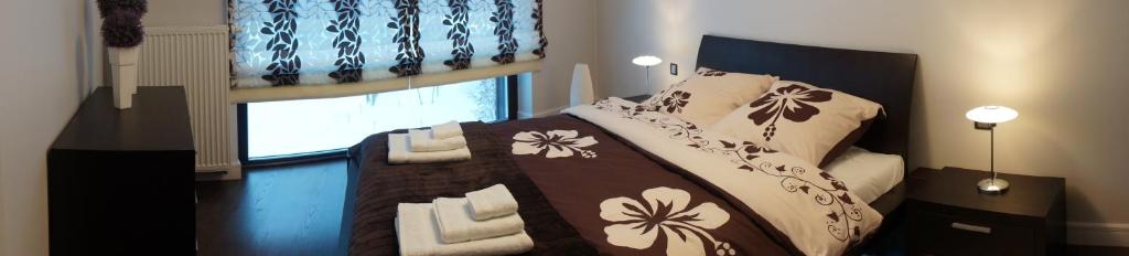 Posteľ alebo postele v izbe v ubytovaní Apartament W&J
