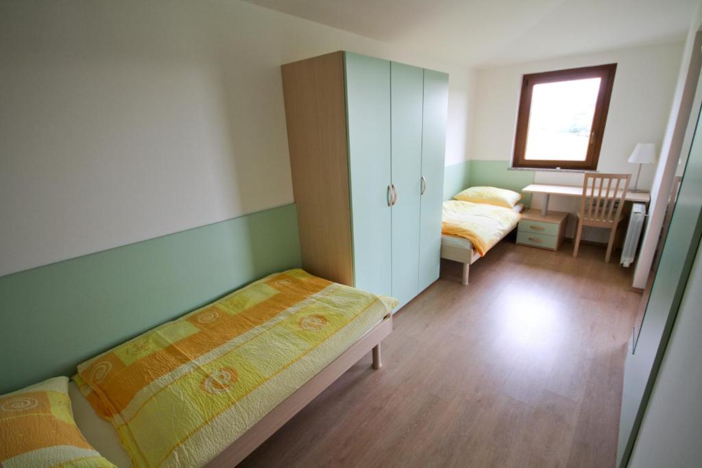 Postel nebo postele na pokoji v ubytování Zoi Apartments