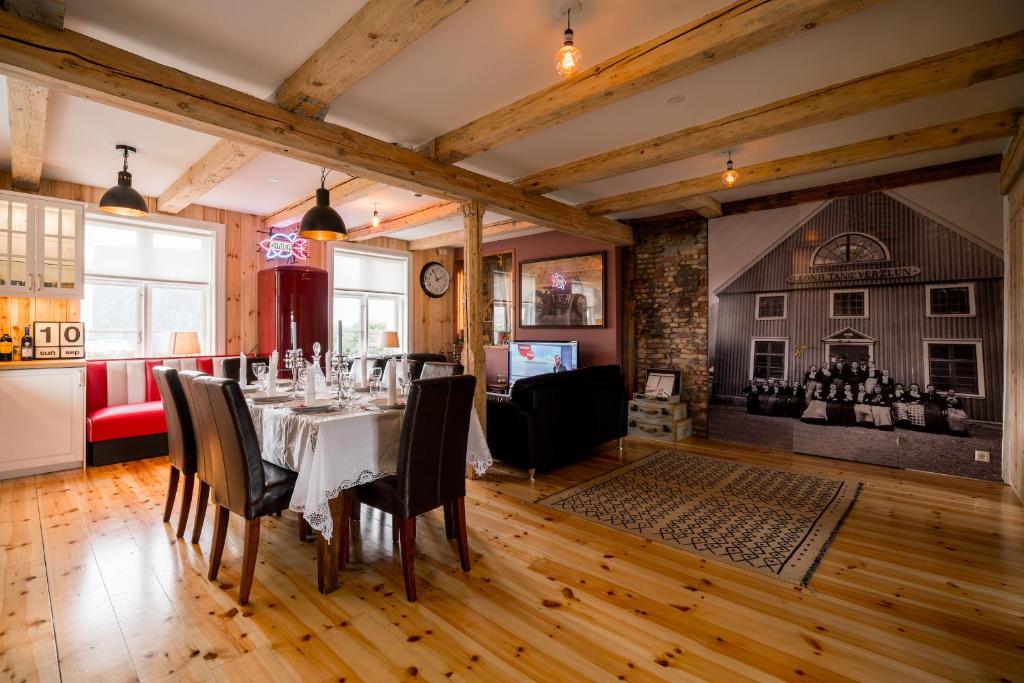 a dining room with a table and chairs at Tangs in Ísafjörður