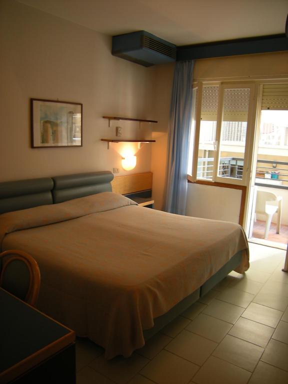 Postel nebo postele na pokoji v ubytování Hotel Ambasciatori Palace