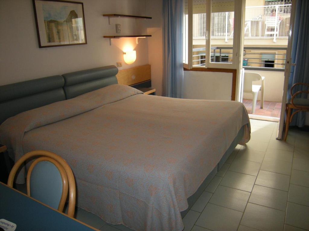 Postel nebo postele na pokoji v ubytování Hotel Ambasciatori Palace