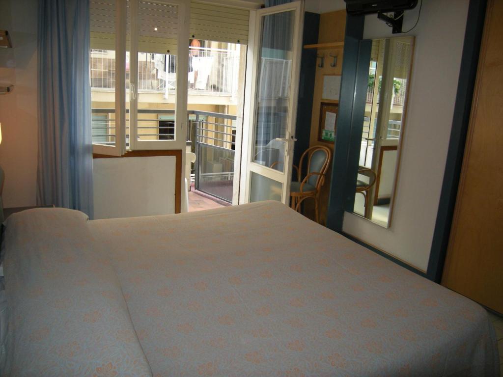 Postel nebo postele na pokoji v ubytování Hotel Ambasciatori Palace