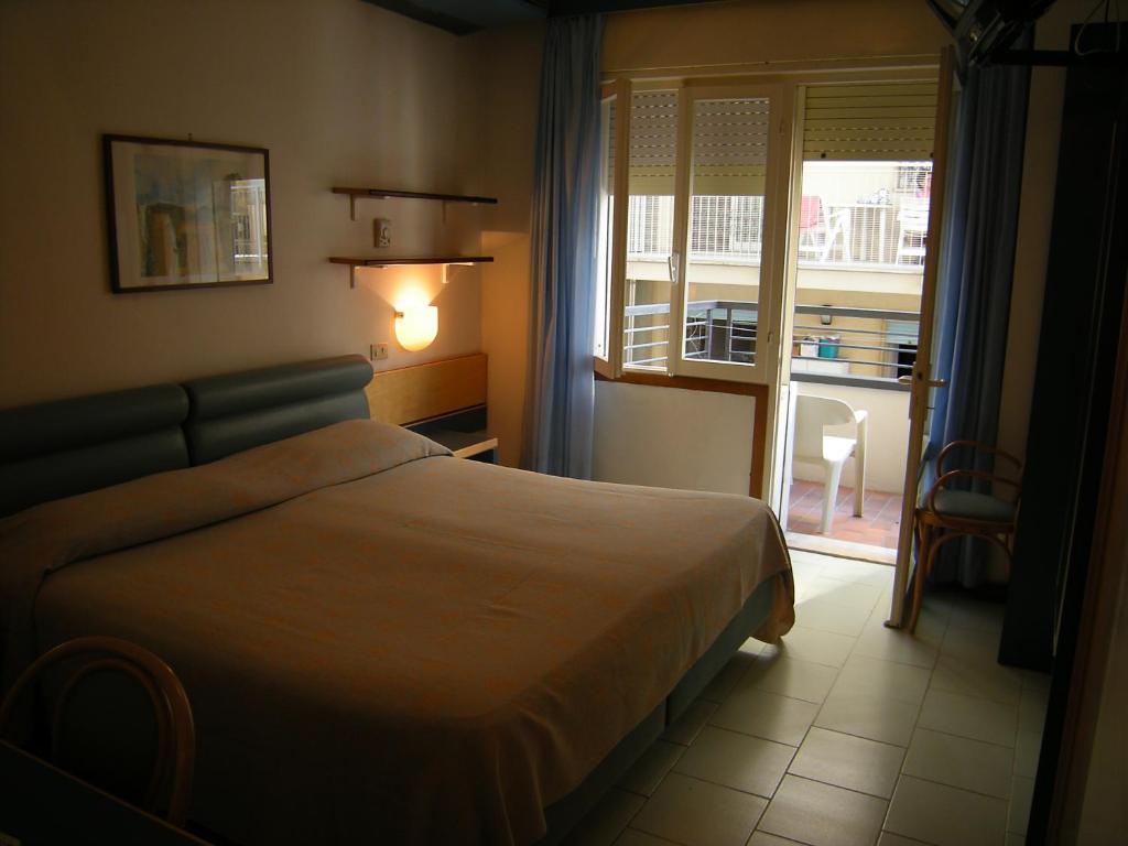 Postel nebo postele na pokoji v ubytování Hotel Ambasciatori Palace