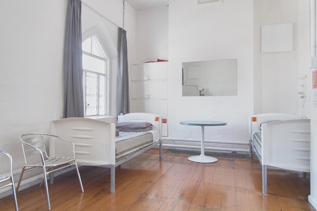 Postel nebo postele na pokoji v ubytování Jailhouse Accommodation