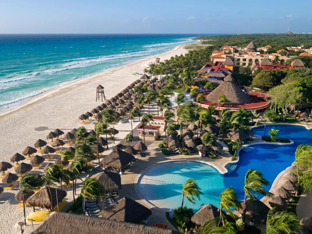 an aerial view of the beach at the excellence punta cana resort at Iberostar Quetzal in Playa del Carmen