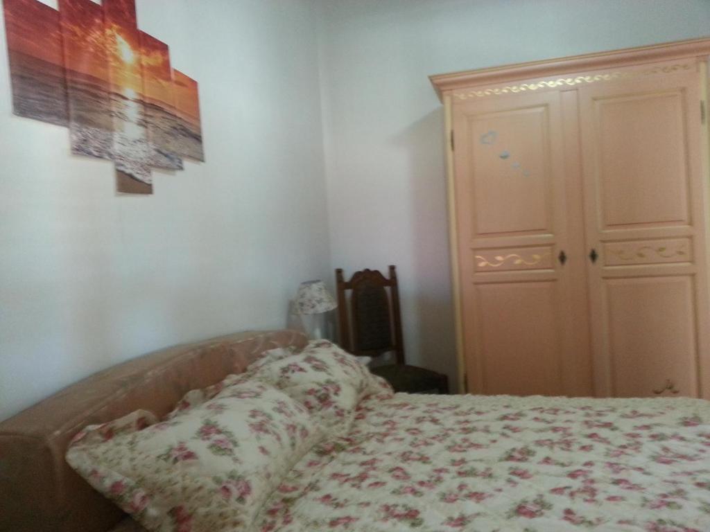 A bed or beds in a room at Casa di Lory Bruca