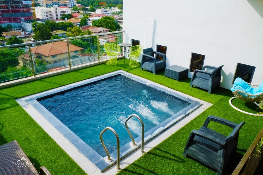 a swimming pool on the roof of a building at Castle Peak Hotel in Cebu City