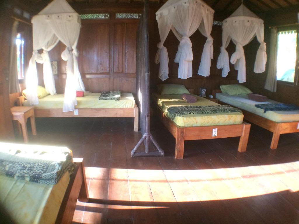 Postel nebo postele na pokoji v ubytování Green Paddy Hostel & Villa