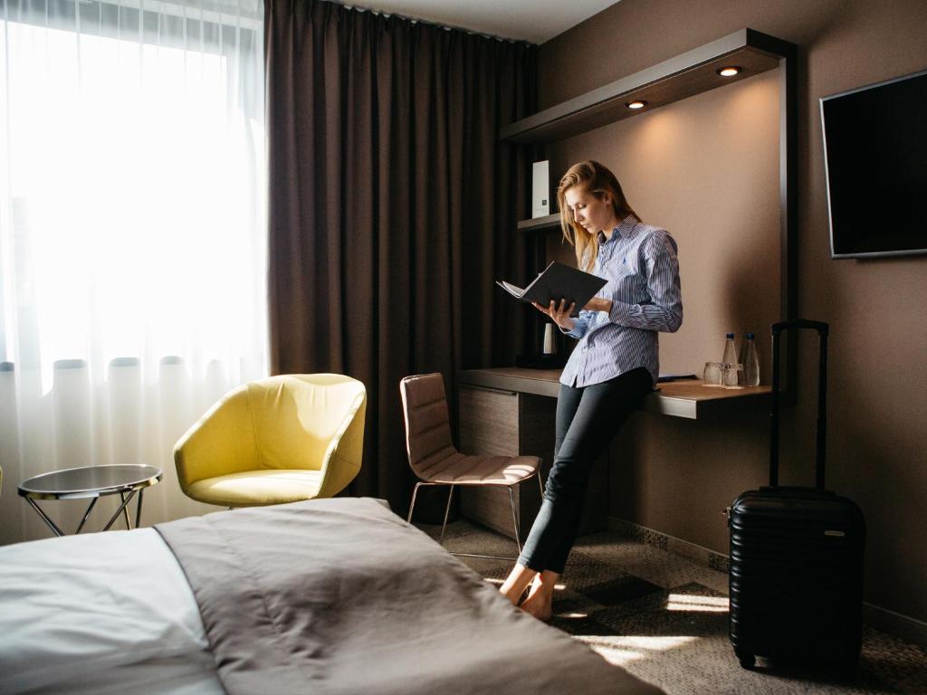 TV a/nebo společenská místnost v ubytování Q Hotel Plus Katowice