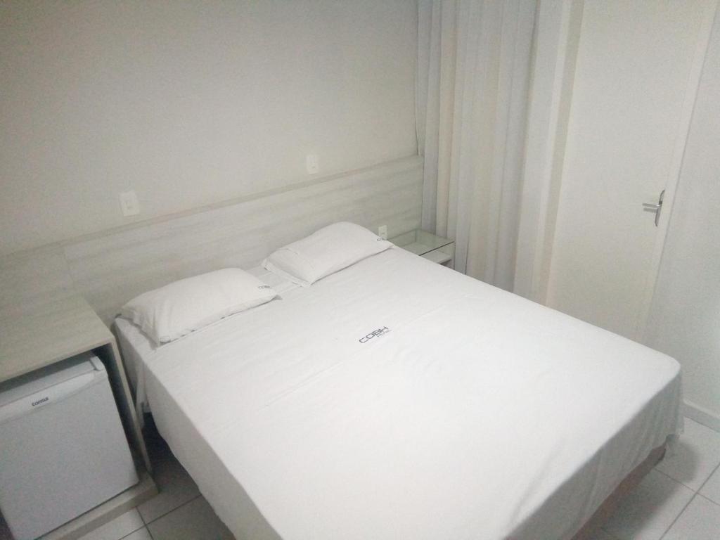Postel nebo postele na pokoji v ubytování COBH Hotel