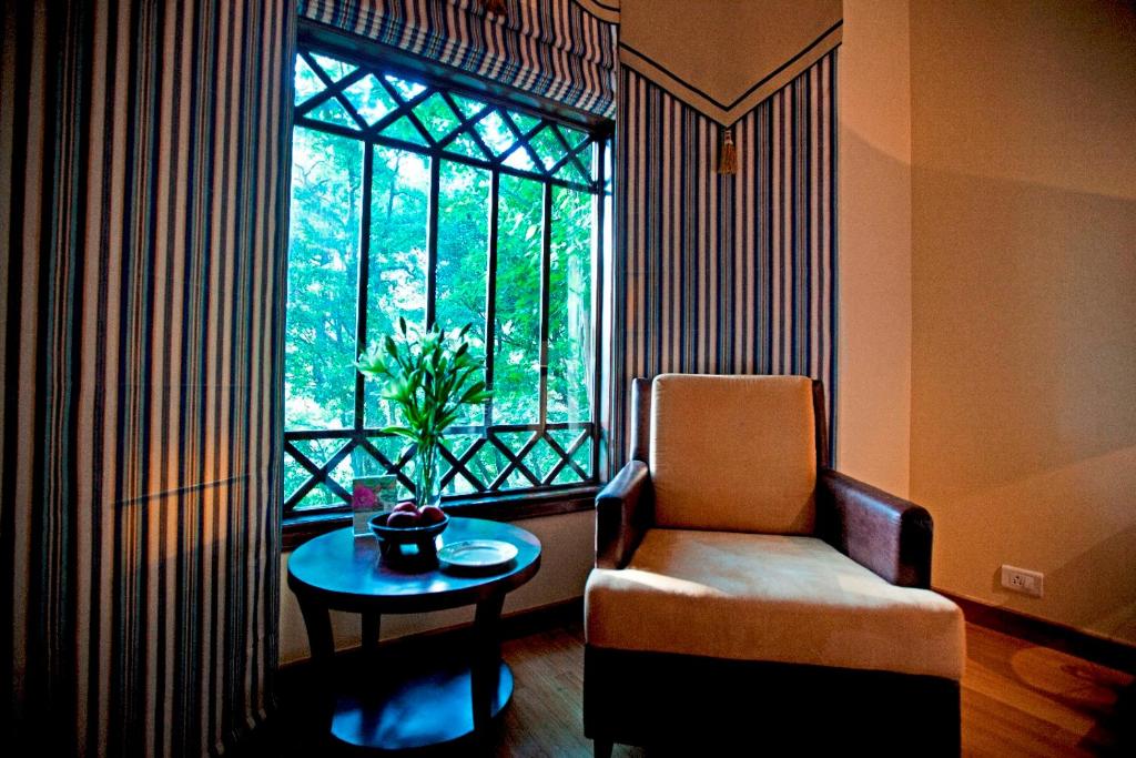 Posezení v ubytování The Claridges Nabha Residence